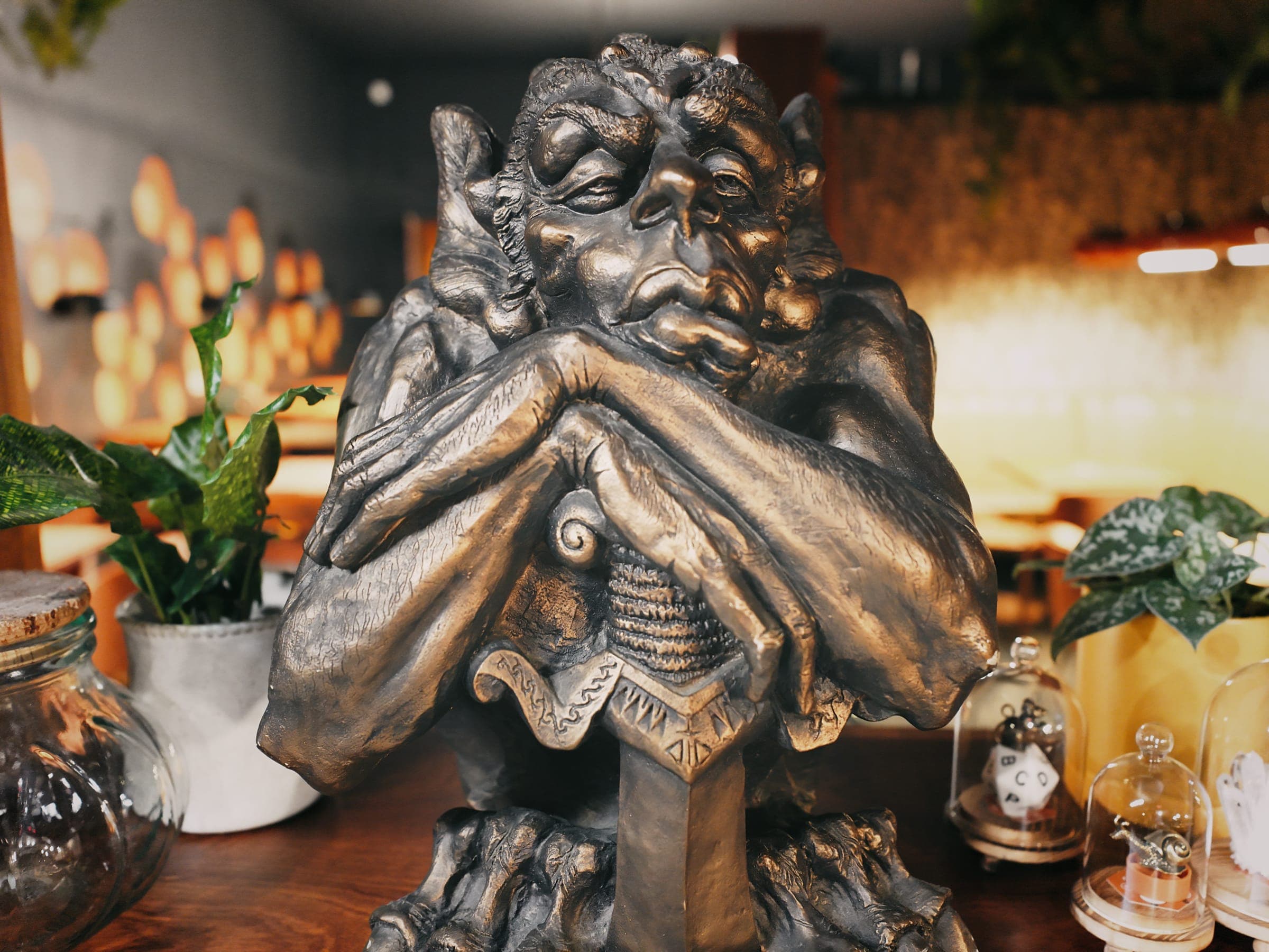 The gargoyle statue among the plants