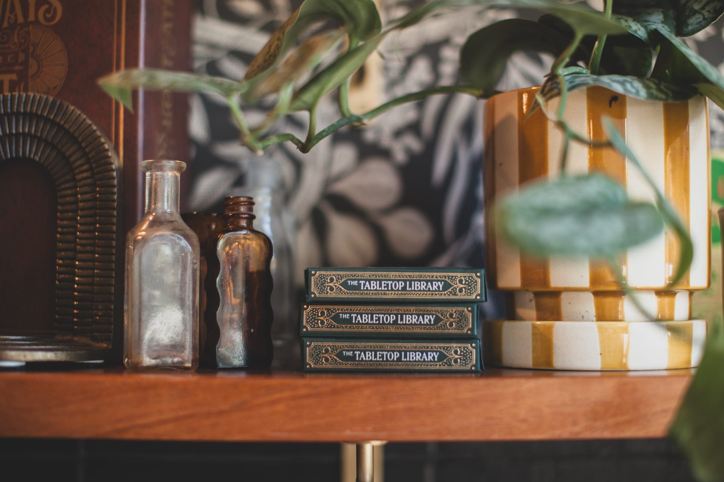 Three Tabletop Library card decks stacked on a shelf